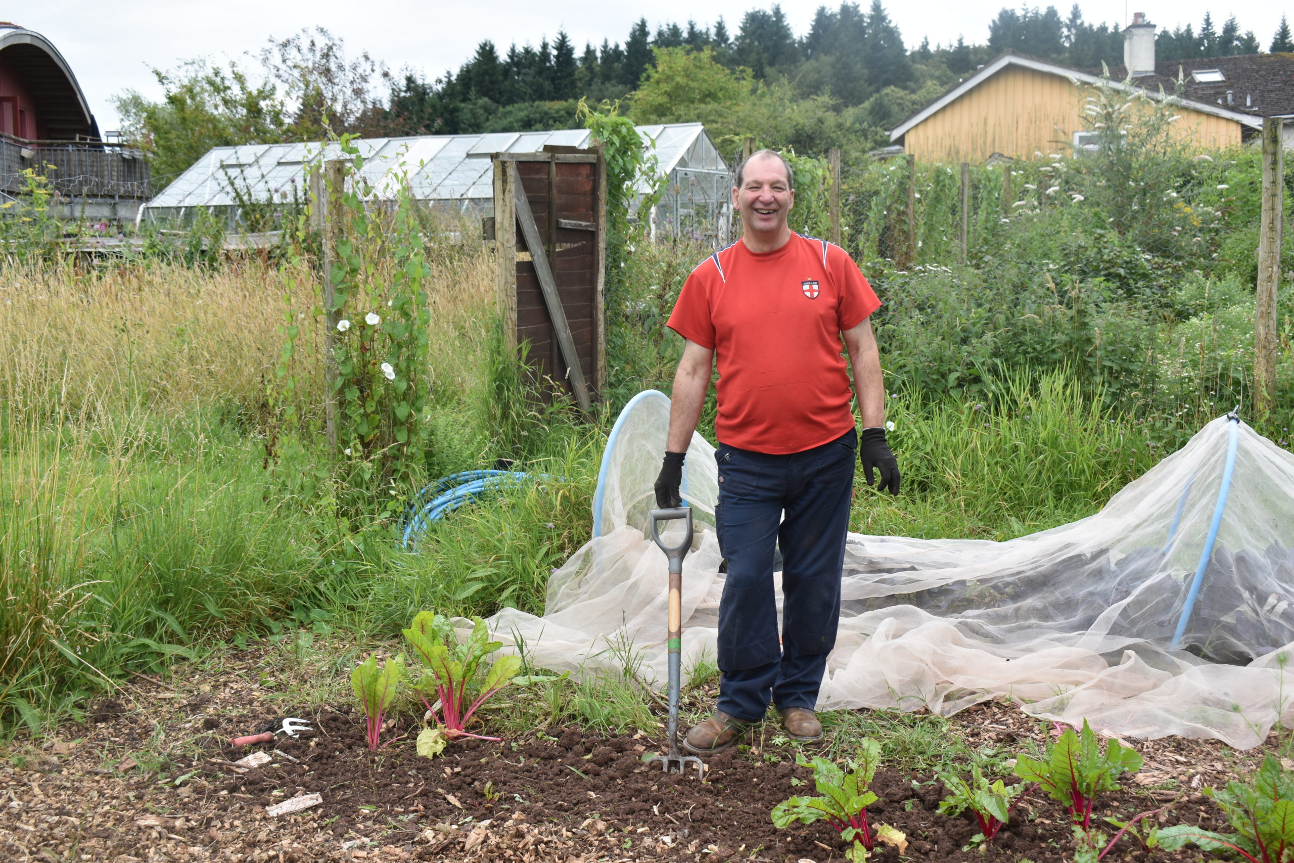 A person we support gardening