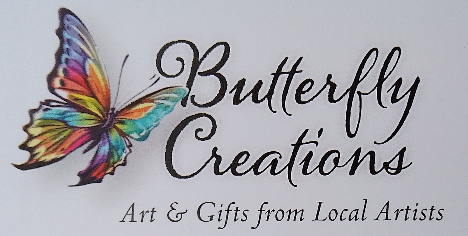 Logo for a company called Butterfly Creations with a colourful illustration of a butterfly