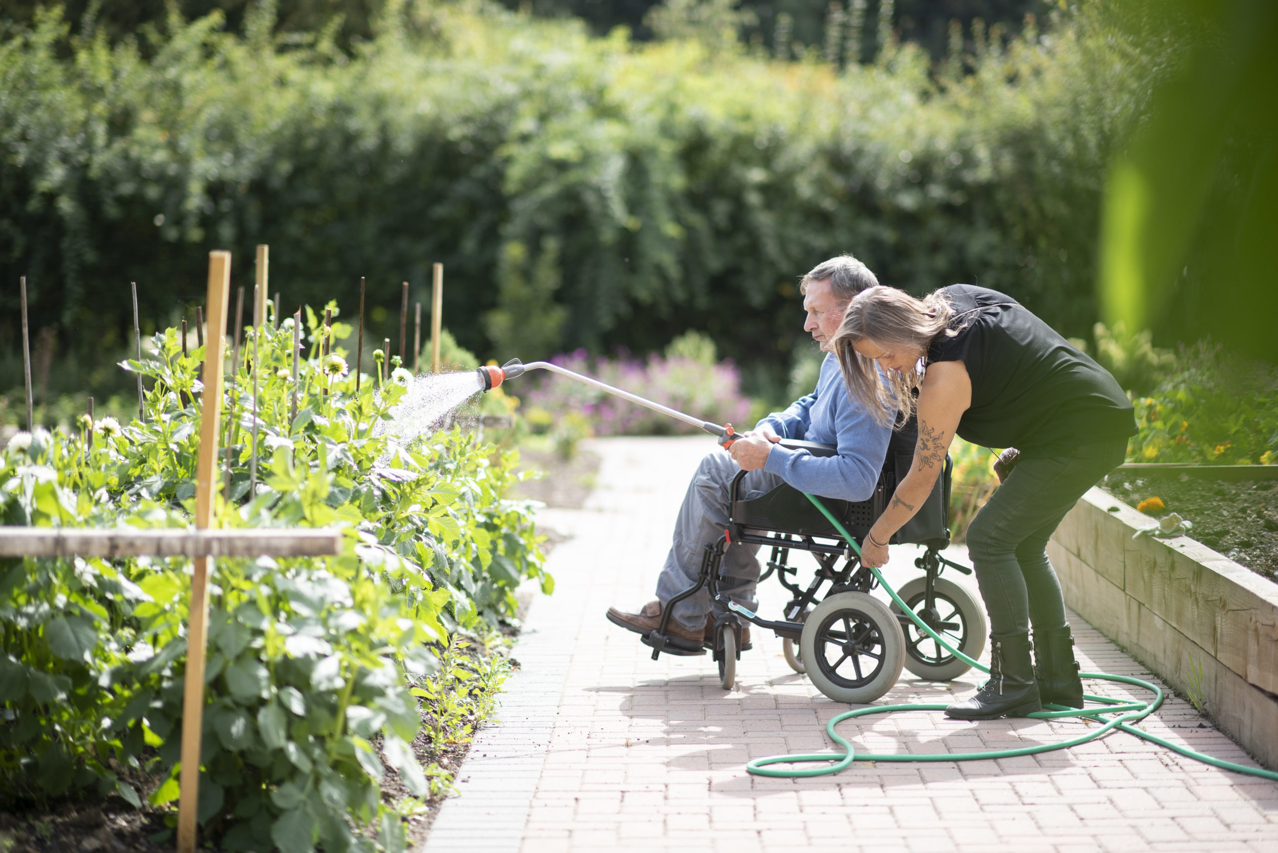 One of the people we support watering plants