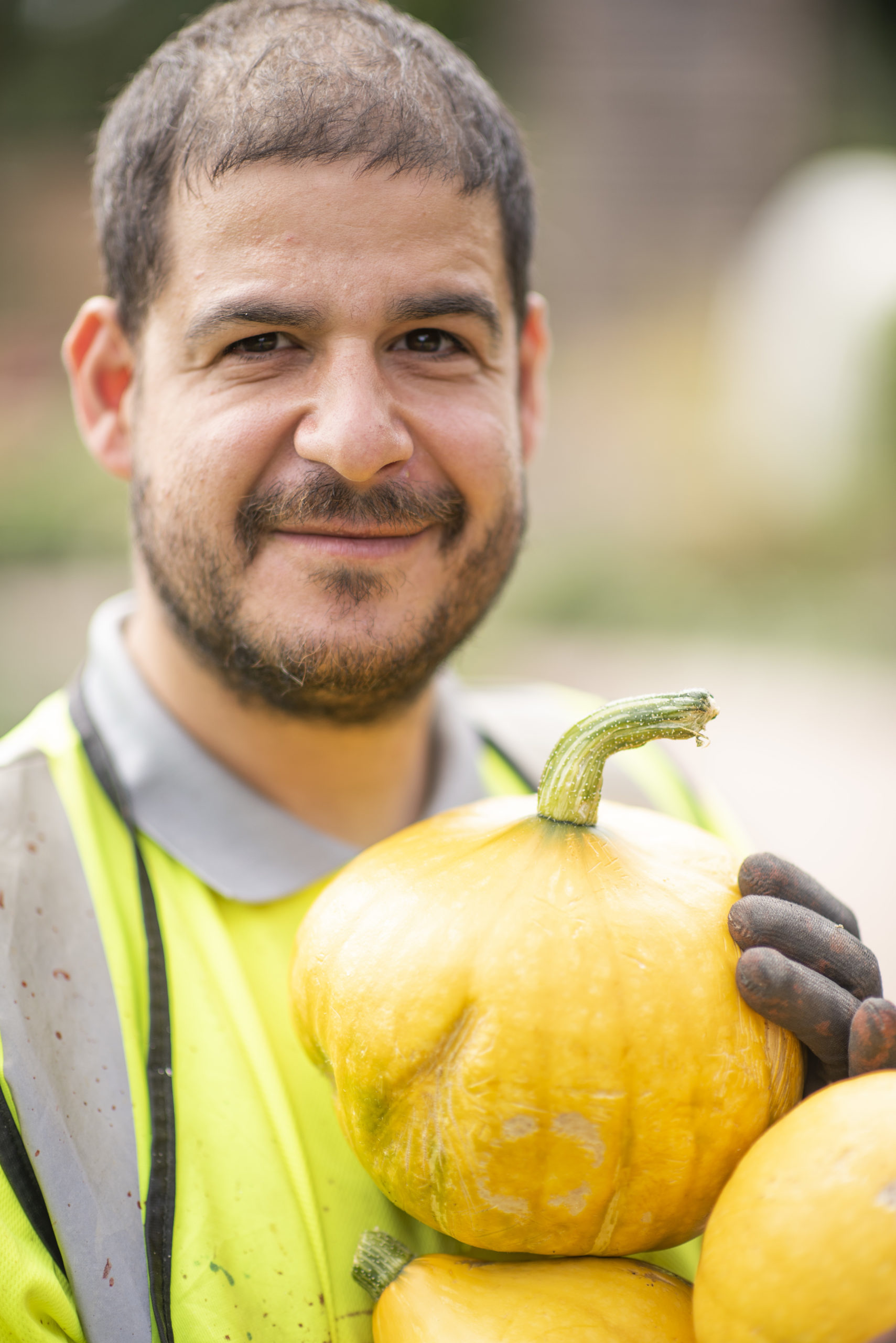 One of the people we support holding a pumpkin