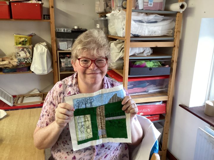 One of the people we support creating a patchwork quilt