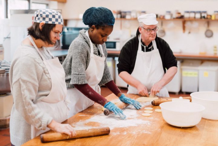 3 people cooking in a kitchen