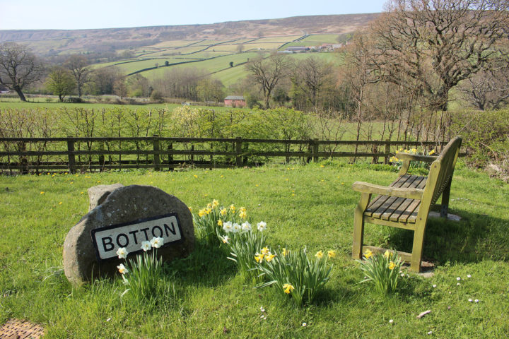 Botton village sign on a rock