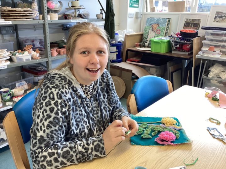 Chloe with her patchwork quilt square