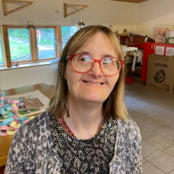 Headshot of a person we support smiling