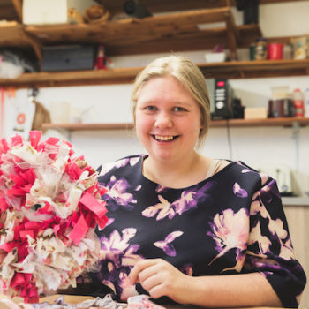 A person we support holding an arts and crafts product she made