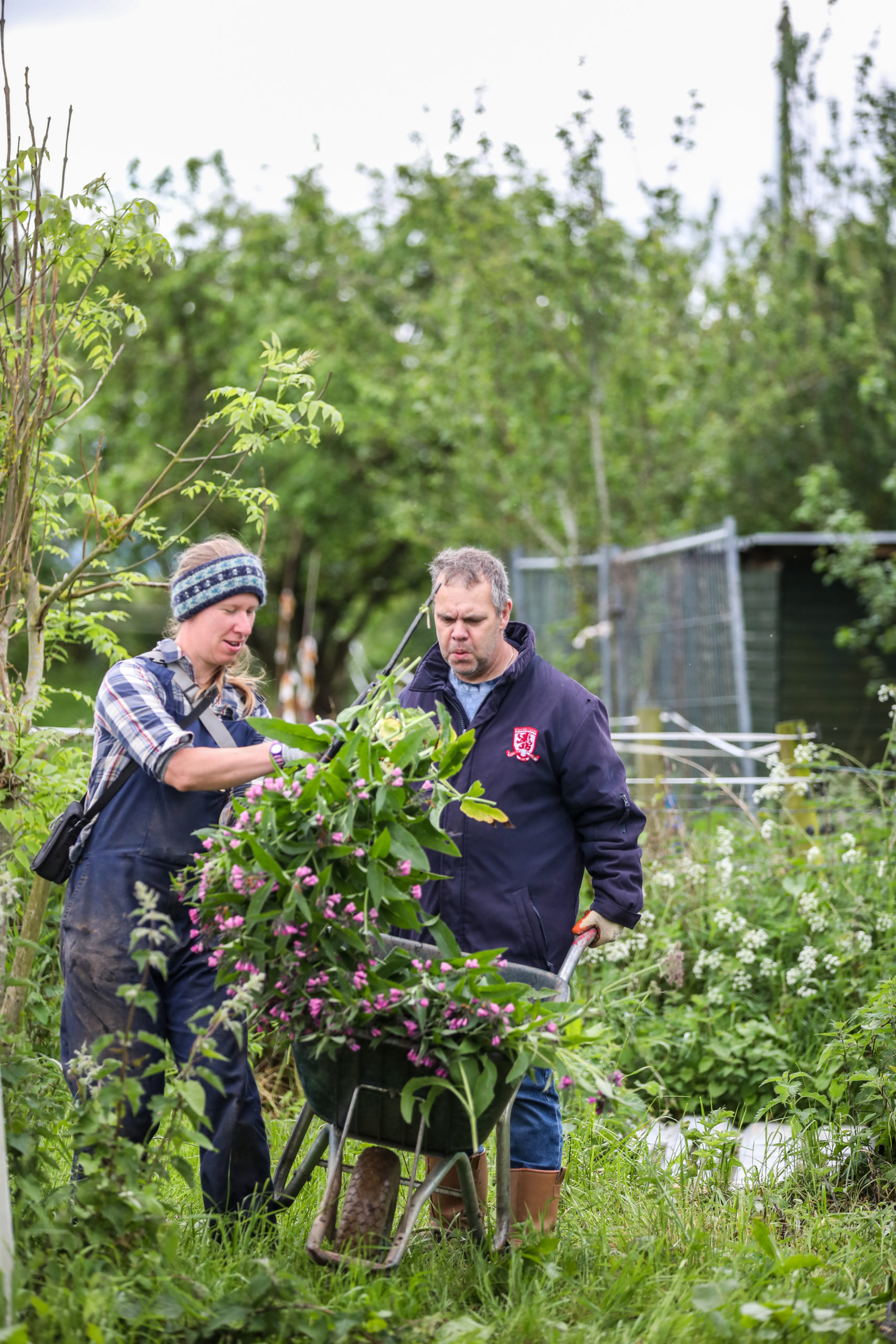 Two people gardening outside