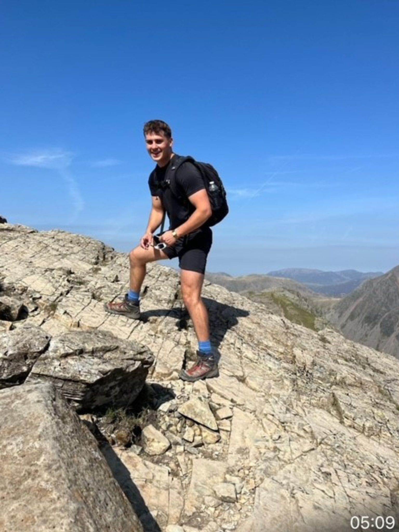 A man hiking up a mountain