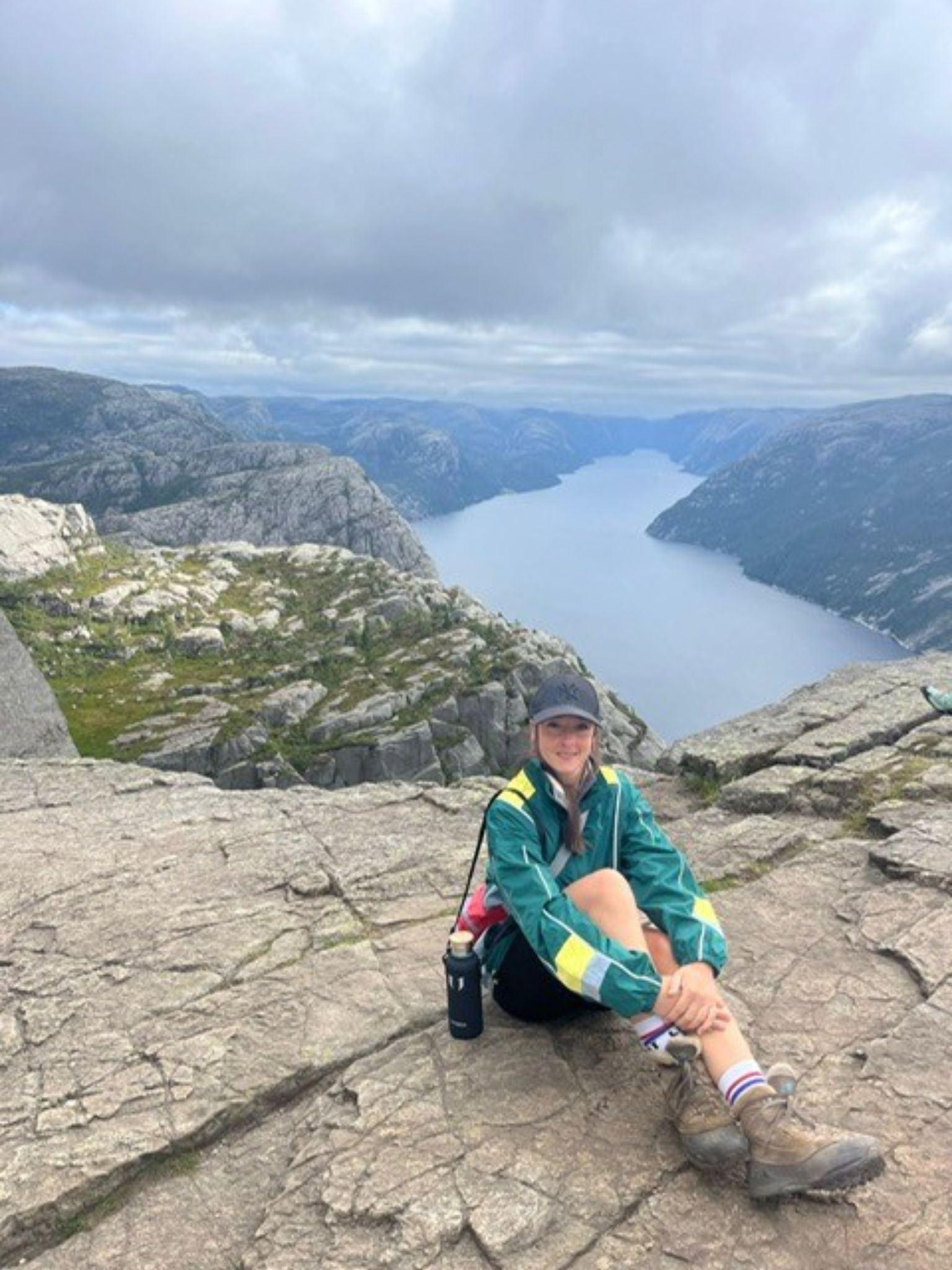 A woman sitting on a mountain