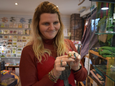 A person we support working in our gift shop in Taurus Crafts