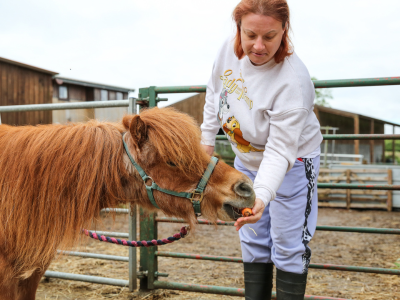 A person with a pony in Larchfield in our day activities for adults with learning disabilities