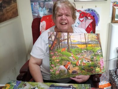 A person we support with her painting