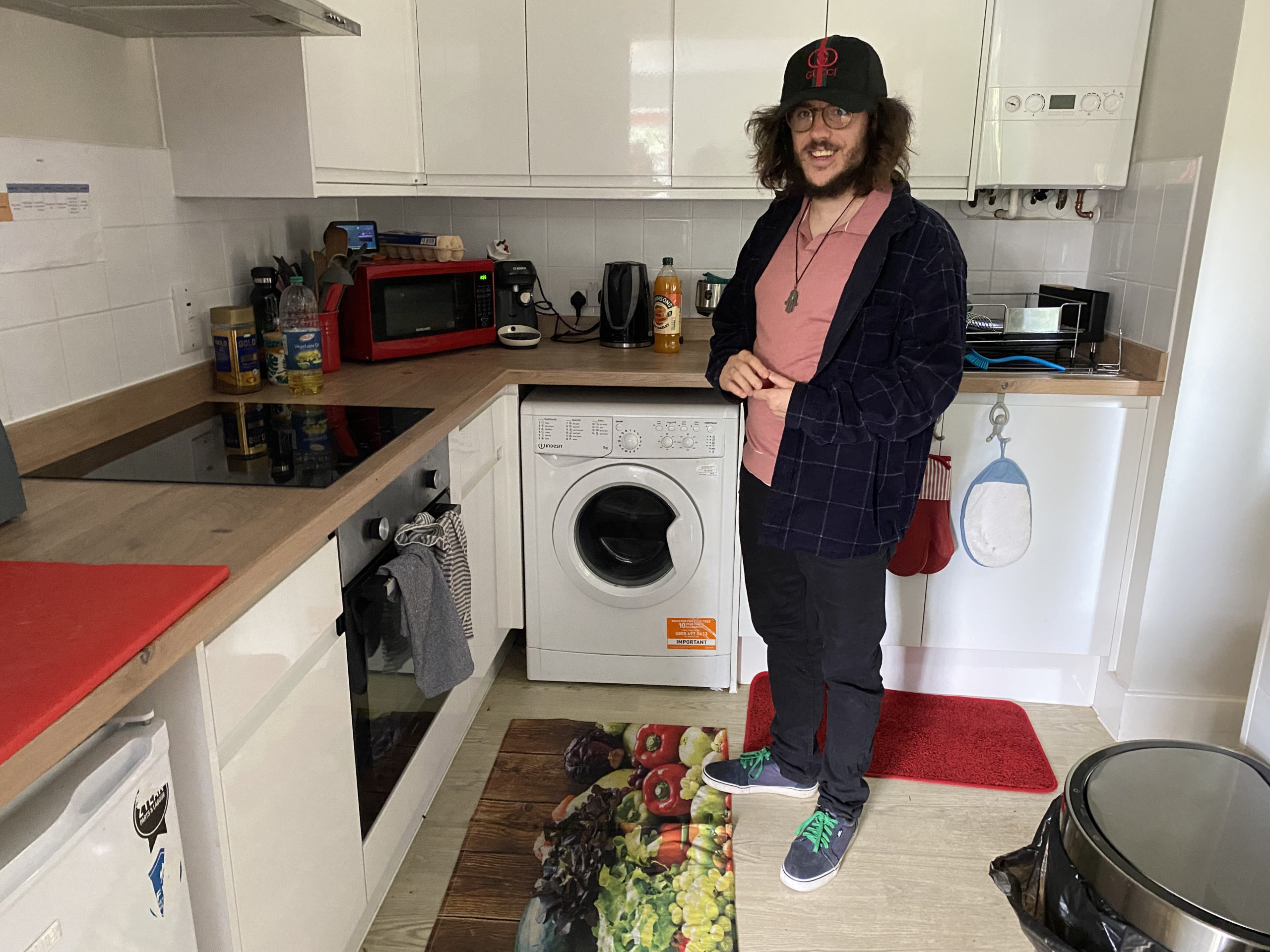 A person we support standing in the kitchen