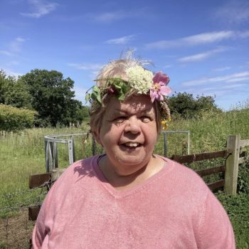 Community members in a craft workshop making flower headbands in Larchfield